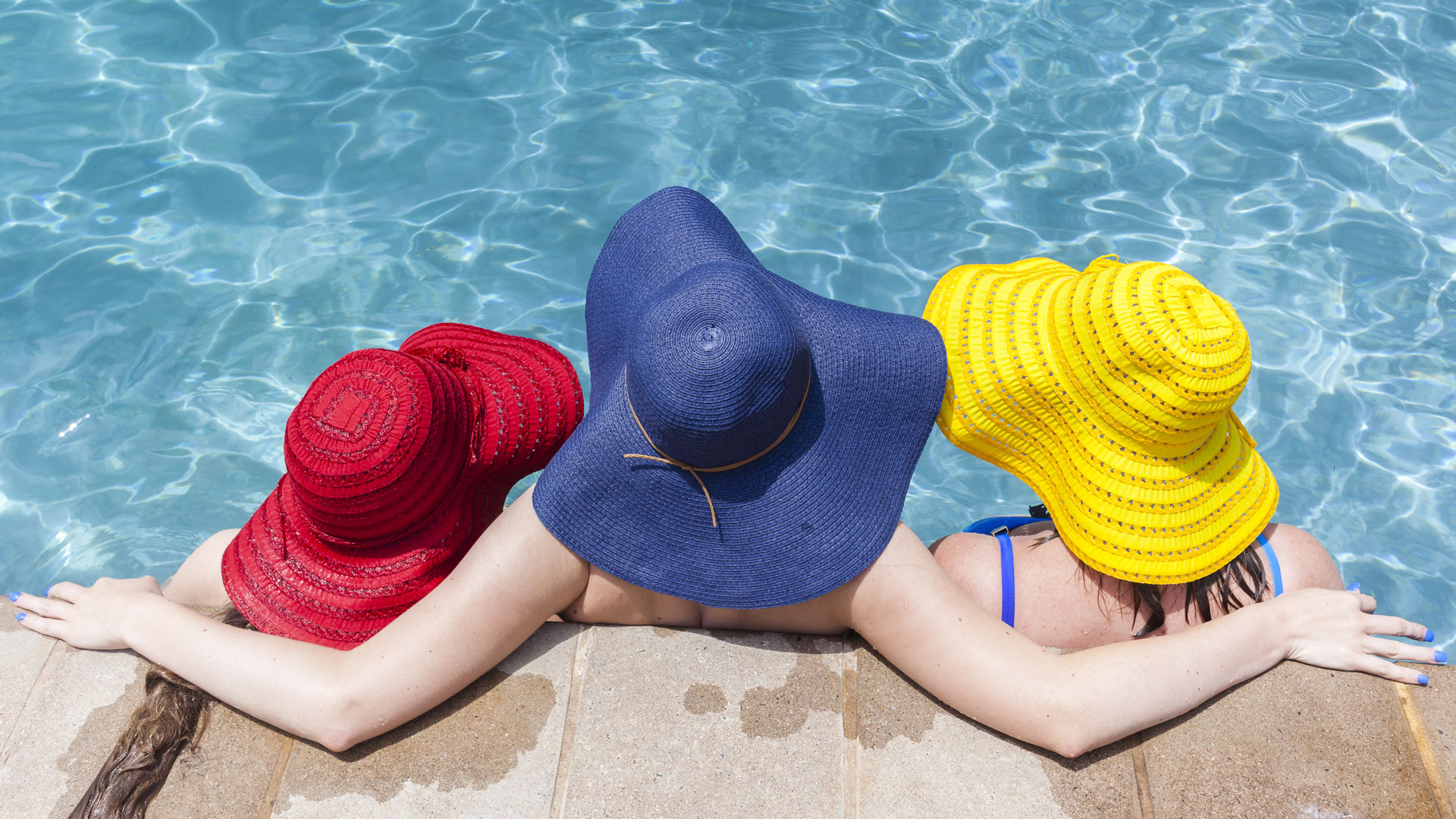 bigstock-girls-hats-pool-112322840